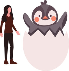 A girl watches penguins hatch from eggs.