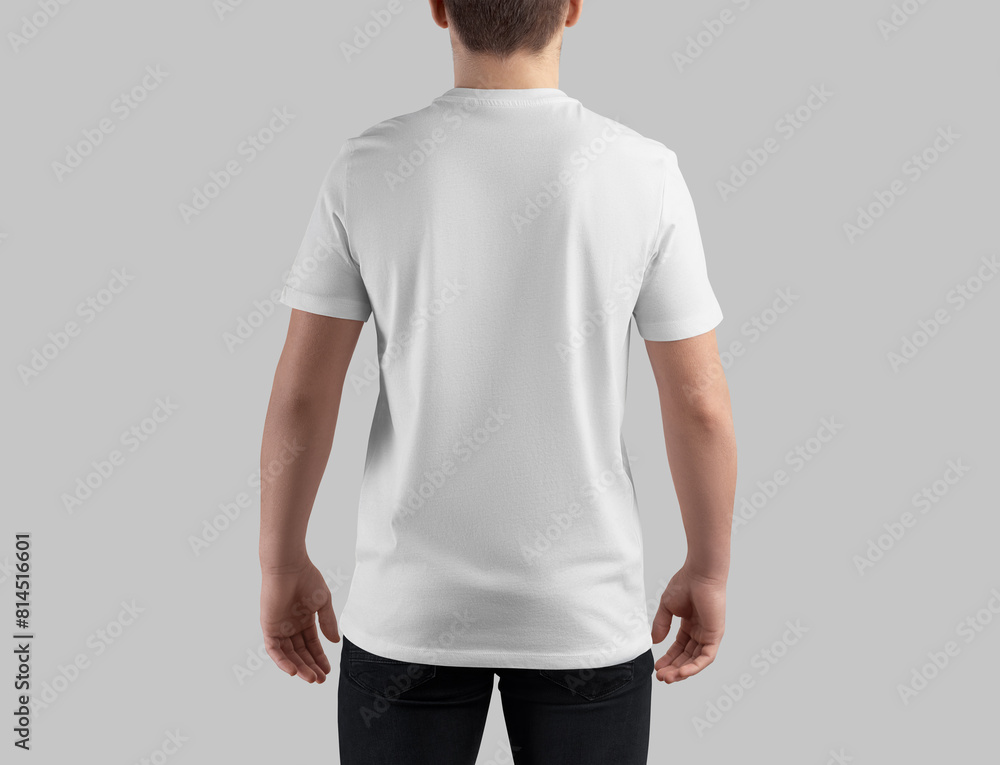 Wall mural Mockup of white t-shirt on guy in dark jeans, back view, blank clothes for design, pattern, branding, advertising. - Wall murals