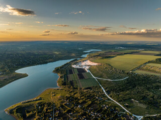 aerial view over Duruitoarea limestone quarry at the prut river shore on the north of moldova during sunset