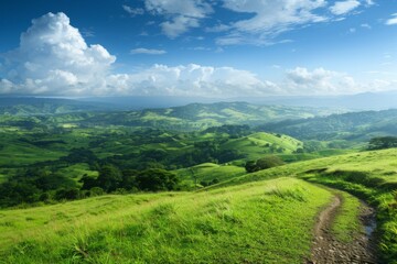 Fototapeta premium Lush Green Hills Under Bright Blue Sky
