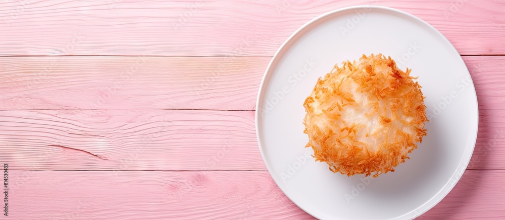 Poster Top down view of a fried camembert atop a pink plate situated on a pristine white wooden surface The arrangement offers ample copy space for text within the frame