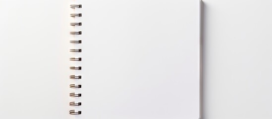 Top view copy space image of a notebook placed on a white background