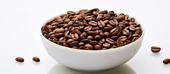 Fototapeta premium A cup of roasted coffee beans on a white background with plenty of copy space for other elements of your design