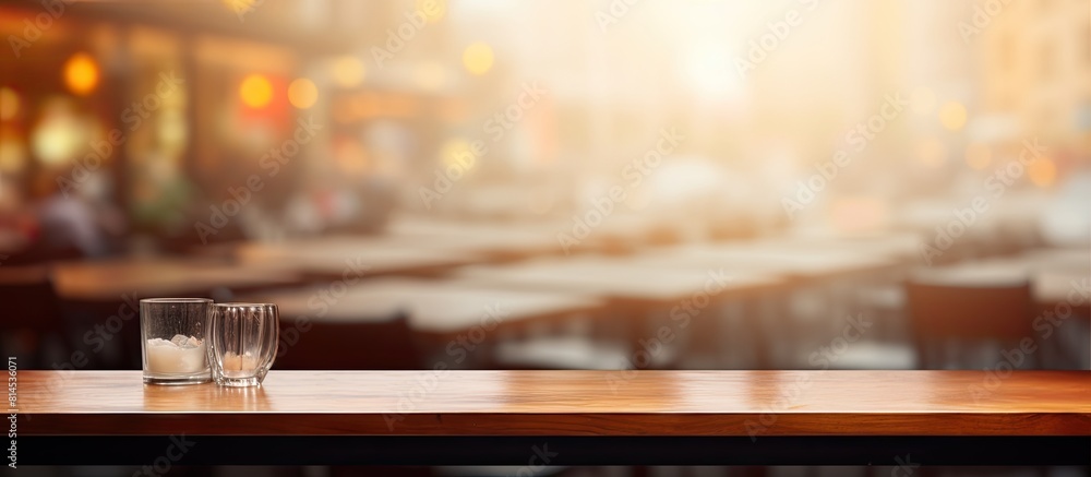 Poster There is a copy space image of a table top with a blurred restaurant in the background