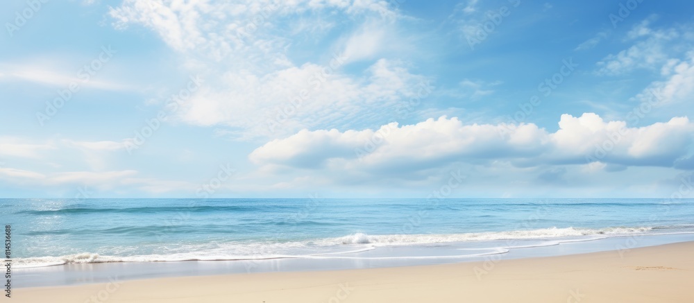 Poster Tranquil serene landscape featuring a wide empty sand beach adorned by a beautiful cloudy sky offering a perfect atmosphere for relaxation Ample copy space image available for creative usage