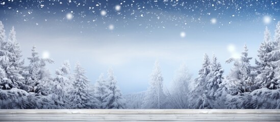 Fototapeta premium A stunning Christmas backdrop featuring snow covered branches of a tree resting on a wooden table with empty space for adding your own images. with copy space image. Place for adding text or design