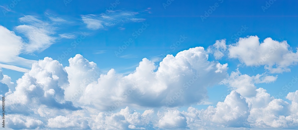 Poster the expansive blue sky with fluffy clouds as a copy space image