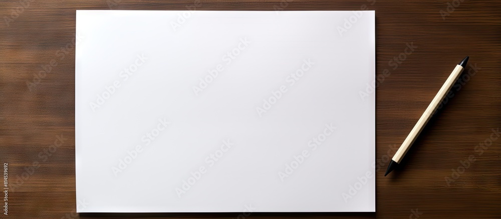Poster top view of a blank paper and pen on a desk with empty space for text or image. with copy space imag