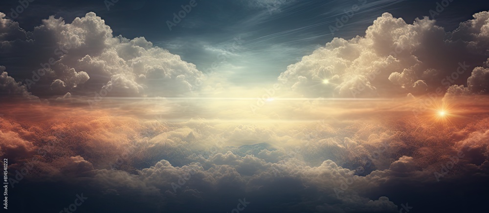 Aufkleber The cloudy sky is illuminated by a beam of light creating a picturesque backdrop with trees in the frame perfect for a copy space image