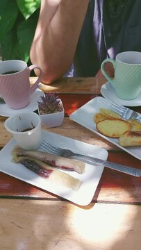 Vertical. Enjoying a wonderful summer afternoon having coffee, suman and fried kamote which is a traditional local Filipino merienda snack