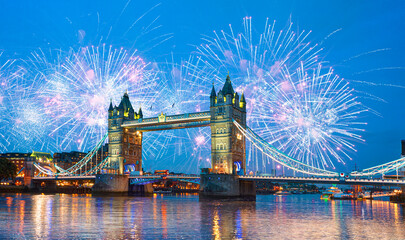Fireworks over Tower Bridge and Tower of London on Thames river at twilight blue hour - London...