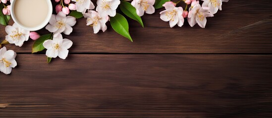 A copy space image of jasmine tea with fresh jasmine flowers beautifully arranged on a rustic...