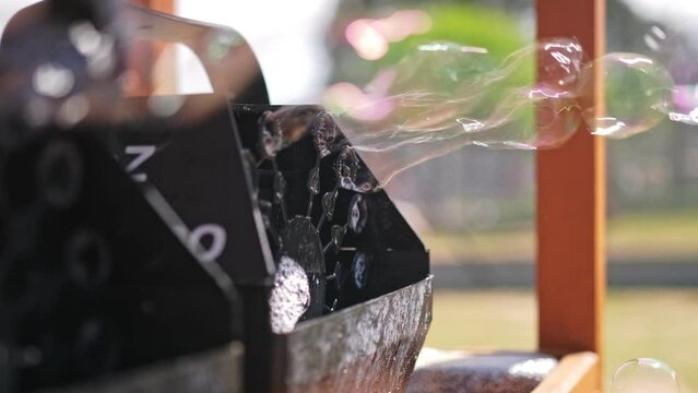 Automatic Soap Bubble Blowing Machines Used on Open Air Outdoor Festival Community Picnic Party