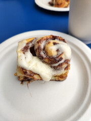 Cinabons on paper plates. Sweet pastries