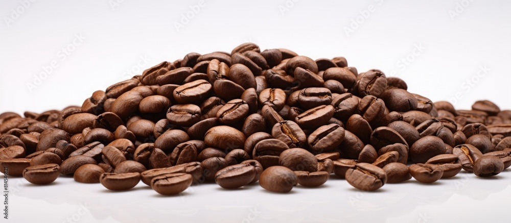 Poster an isolated heap of roasted coffee beans with copy space for advertisement or design purposes