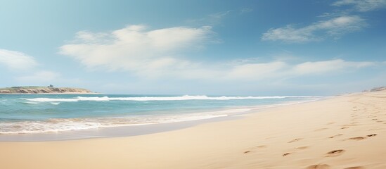 Fototapeta premium A picture of a sandy beach with plenty of empty space for adding text or images. with copy space image. Place for adding text or design
