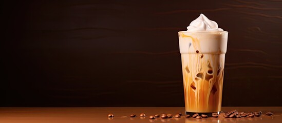 Copy space image of a creamy iced coffee with a generous amount of milk and a dash of coffee