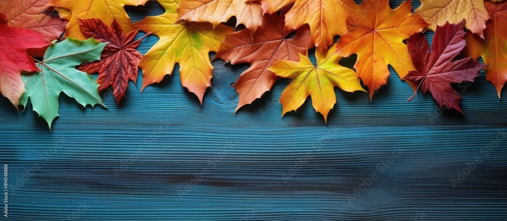 Poster A visually appealing copy space image showcasing vibrant autumn leaves scattered across a colorful backdrop