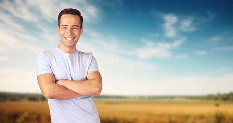 Portrait of smiling man farmer standing in field,