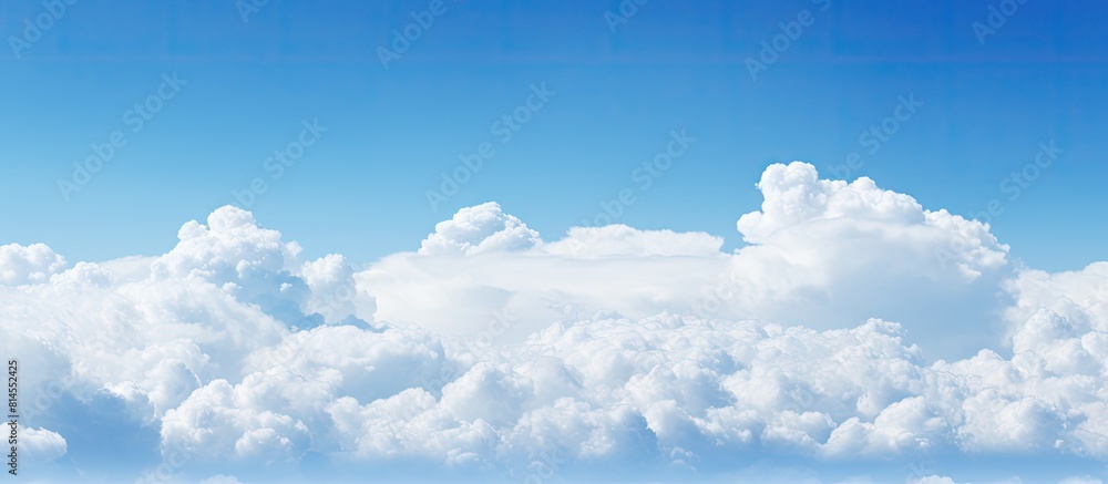 Poster Clear sky with white clouds providing a serene backdrop for a copy space image