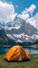 A tent pitched on the steep side of a mountain, overlooking the stunning landscape below