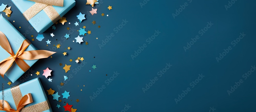 Aufkleber A top view of a blue table background with a gift box and various color paper decorations creating a design concept perfect for Father s Day The image has ample copy space