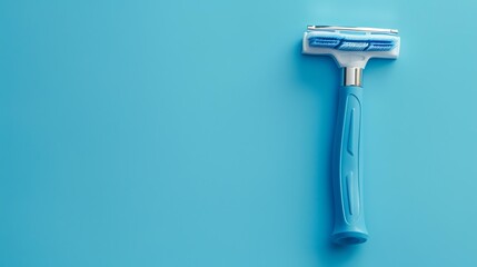 Light blue simple men's razor on a blue background. The razor has five blades and a lubricating strip. The handle is ergonomic and has a rubber grip.