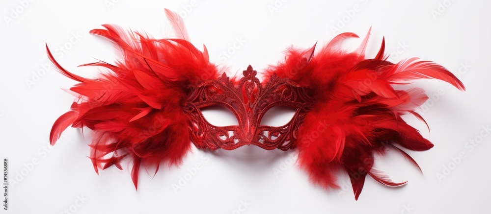 Aufkleber A masquerade mask adorned with vibrant red feathers stands out against a clean white background leaving ample copy space for additional elements