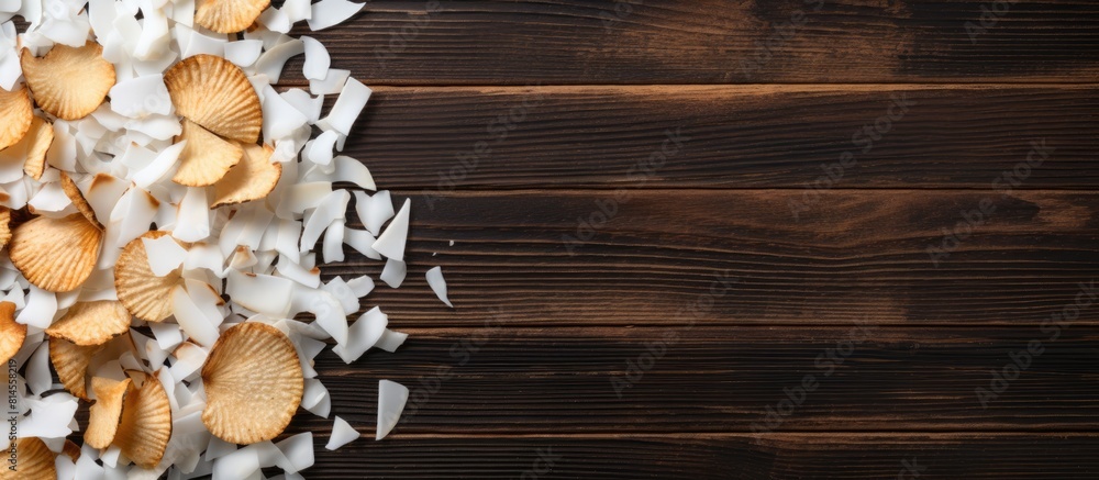 Aufkleber Flat lay of delicious coconut chips placed on a wooden table creating an appetizing display There is ample empty space for text