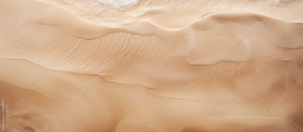 Aufkleber A view from above showcasing a windy day on the beach with an abstract pattern of light brown sand texture as the background. with copy space image. Place for adding text or design