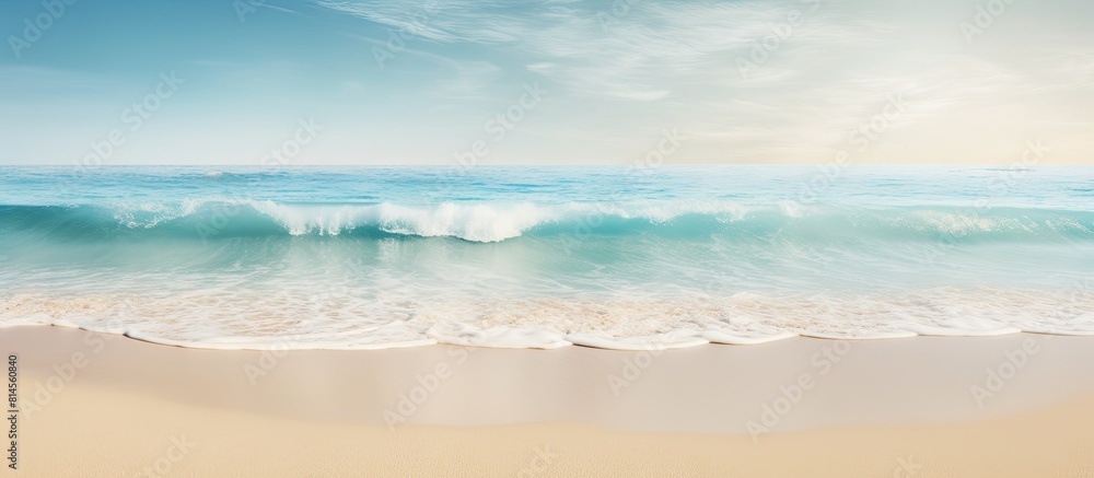 Poster A sandy beach with a gentle sea wave in the background creating a soft foam There is empty space for additional elements in the image