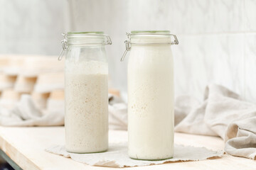 Sourdough for homemade bread in bottles on the table