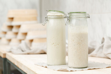 Sourdough for homemade bread in bottles on the table