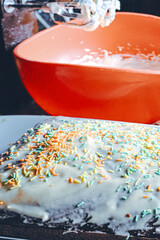 home baked cake and whipped cream in the kitchen