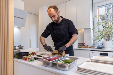 Private chef preparing sushi at home