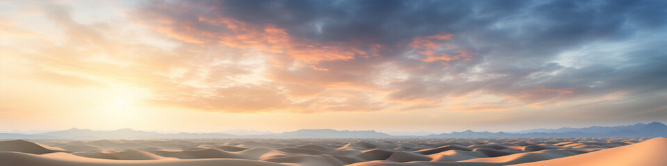 Sand dunes under sunset or sunrise glowing sky with clouds, dramatic desert landscape