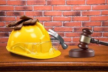 Hammer judge wooden gavel with construction helmet,