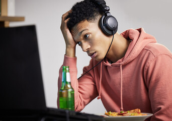 Stress, gaming and man with computer, food and beer at desk for streaming with technology. Pizza, beer and gamer with headphones, fail or mistake in online entertainment, esports or web competition