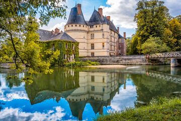 Scenic view of the Chateau of l'Islette in Loire Valley in France with mirror reflection to waters of river Indre 