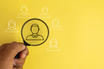 Magnifying glass focos on leader,team,employee between other people idea for finding a job,Human Resource Management and Recruitment,Hiring, job recruitment.