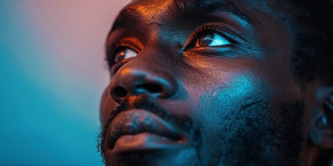 Vibrant close-up portrait of thoughtful african man.