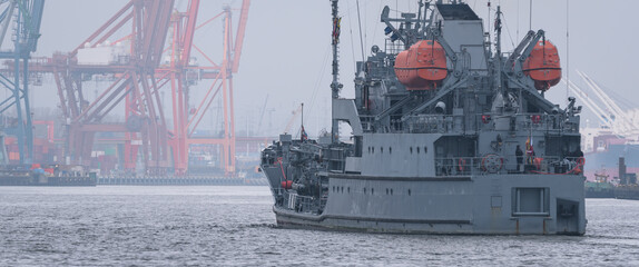 WARSHIP - A navy fuel tanker maneuvers in a seaport