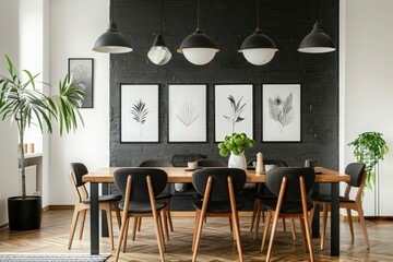 Black and white dining room with wooden table and posters 