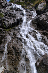 Close-up photo of Capra waterfall on Transfagarasan mountain road in Romania