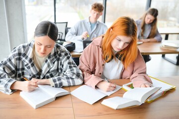 Fototapeta premium Students studying in library or classroom
