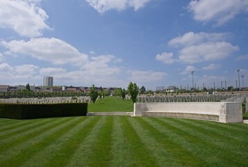 Fototapeta premium Le Petit-Quevilly, France - May 9 2024: This War Cemetery at Saint-Sever cemetery in Rouen contains the graves of about 300 Commonwealth soldiers killed during Second World War. Selective focus