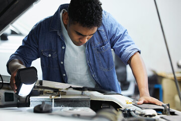 Workshop, mechanic or man with car engine for inspection, maintenance and professional repair....