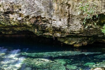 the water is crystal and clear in a cave by itself