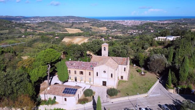 Drone footage of Saint Stephan church with Candelara Cemetery in the background in Candelara , Italy