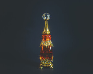 Perfumery. A bottle of oil perfume in oriental style and a glass stick for applying to the body